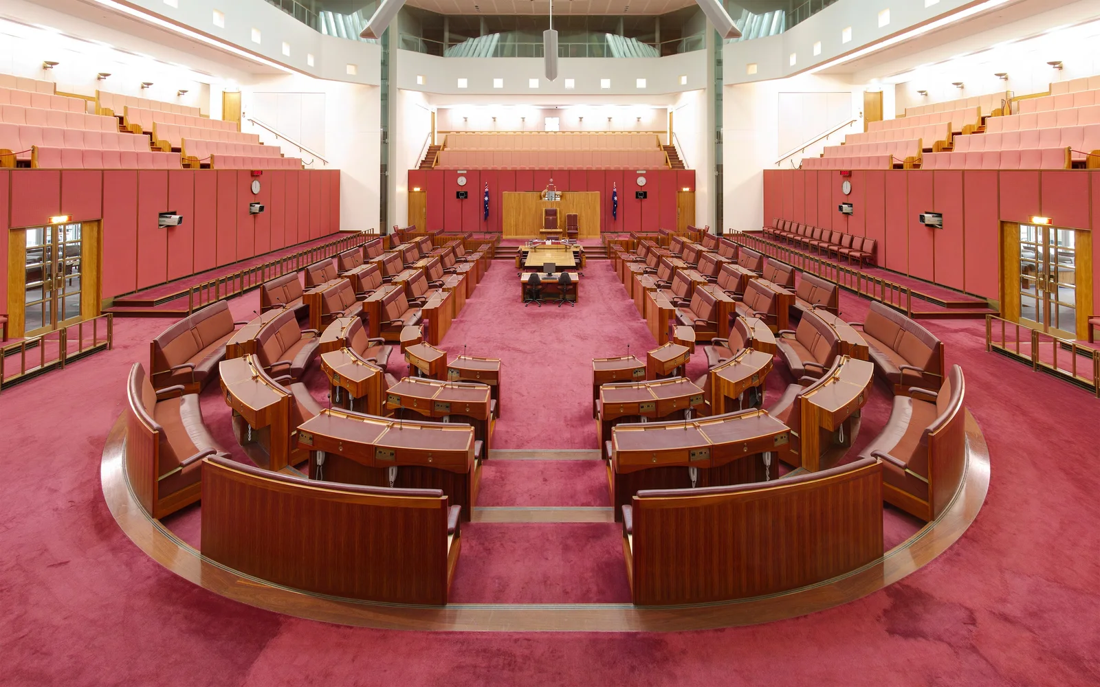 The Senate chamber at Parliament House, Canberra, with its red leather benches arranged in a horseshoe