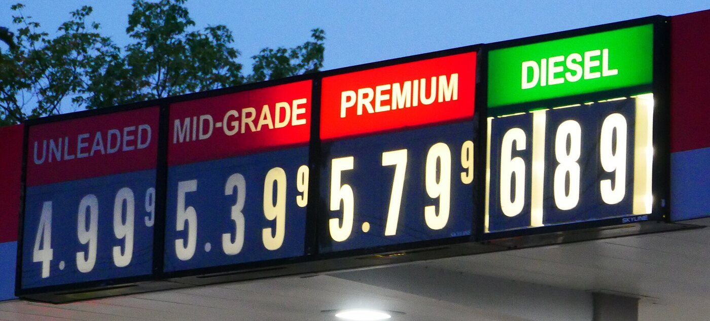 A service station price board reading unleaded 4.99, mid-grade 5.39, premium 5.79, and diesel 6.89
