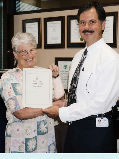 Philippe Foubert presenting Joy Vickerstaff with her Basic Clinical Ethics Course certificate at the Mater Hospitals